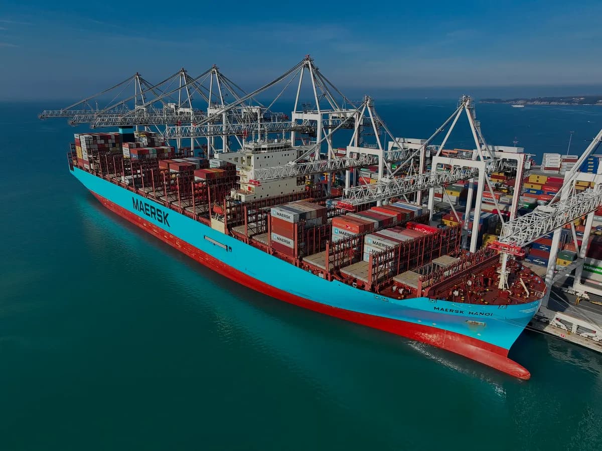 Container cargo ship at port — global commodity trading, BursaKomoditas.com premium domain